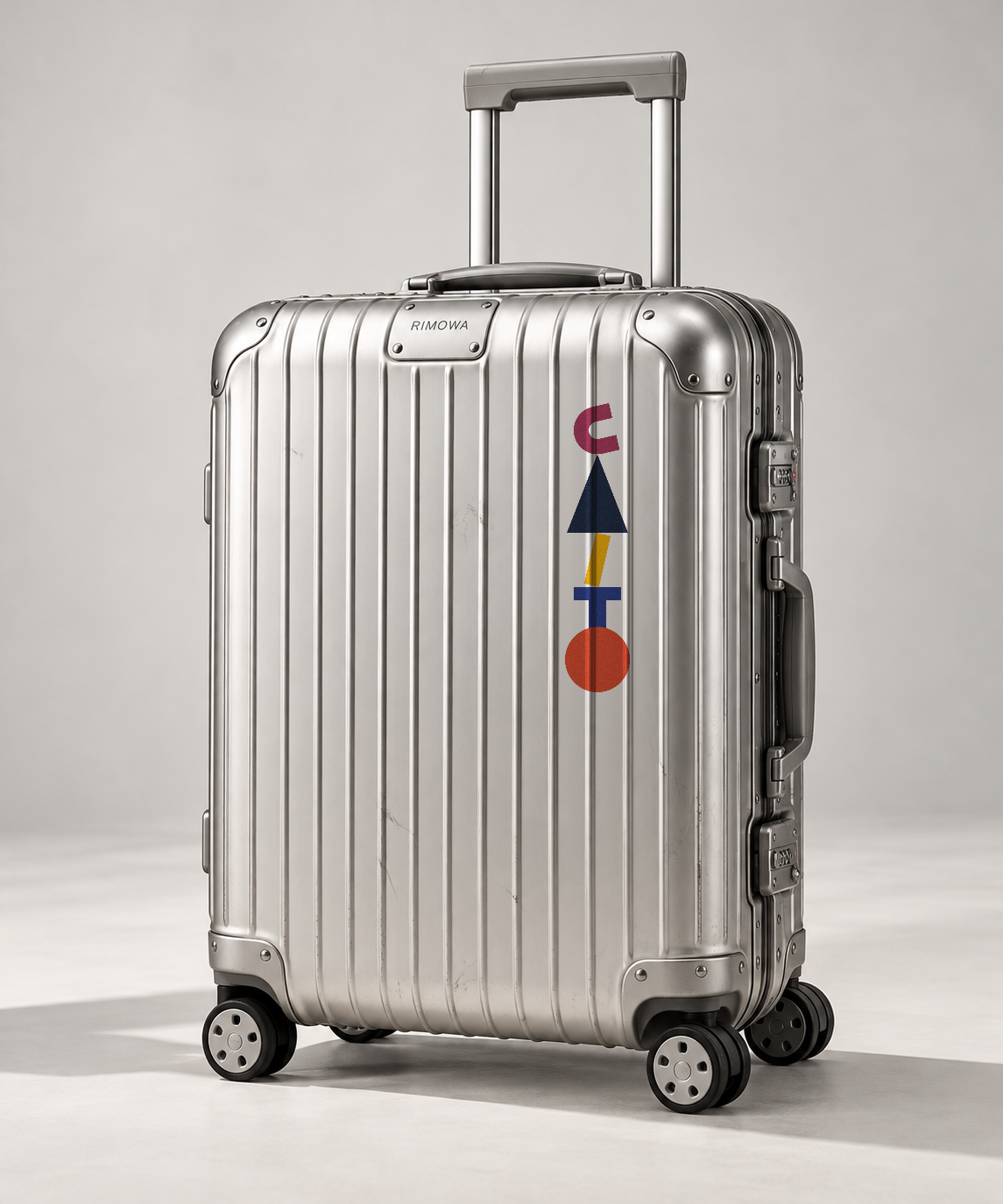 Aluminium carry-on with the Caito Totem sticker